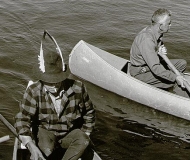 A canoe returns with a full load of wild rice.